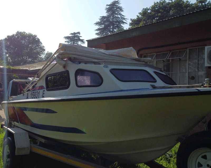 17ft cabin boat with trailer and all necessary paperwork and equipment