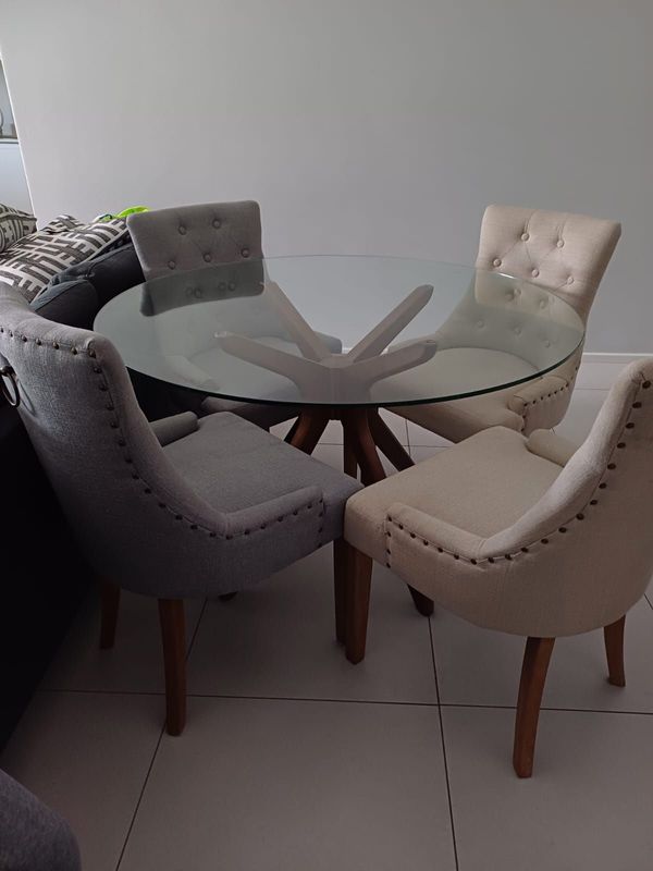 Glass dining table and dining chairs