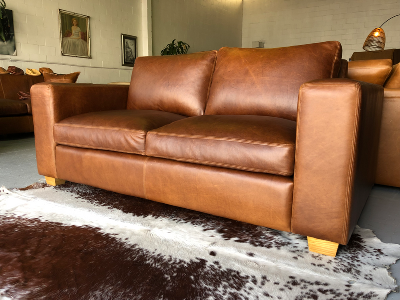 Stunning 1.8m Two seater gameskin genuine leather couch, MODERN CASA DESIGN, Brand new condition.