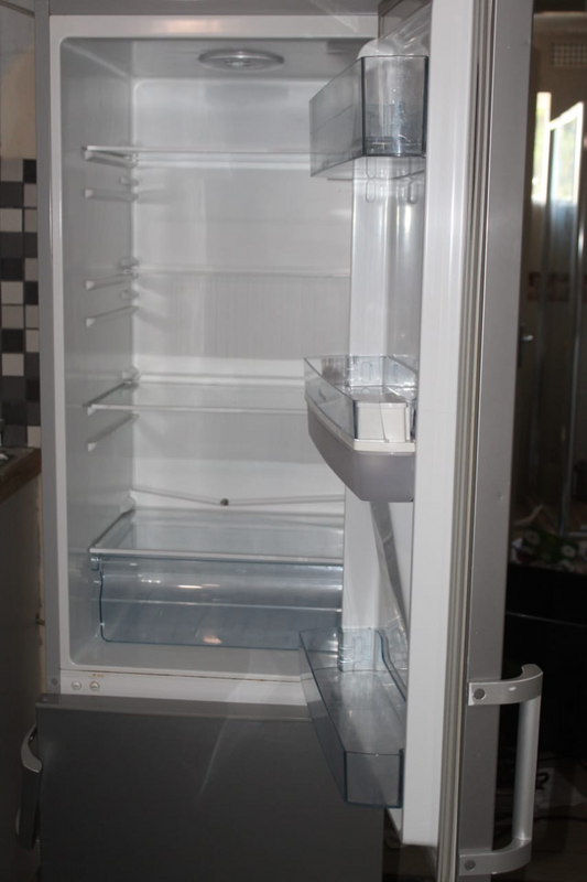 Fridge, freezer with water dispenser. It has a grid at the back of the fridge  R2500