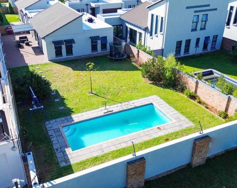 Family-friendly luxury: Enjoy endless fun in the sun in this spacious backyard
