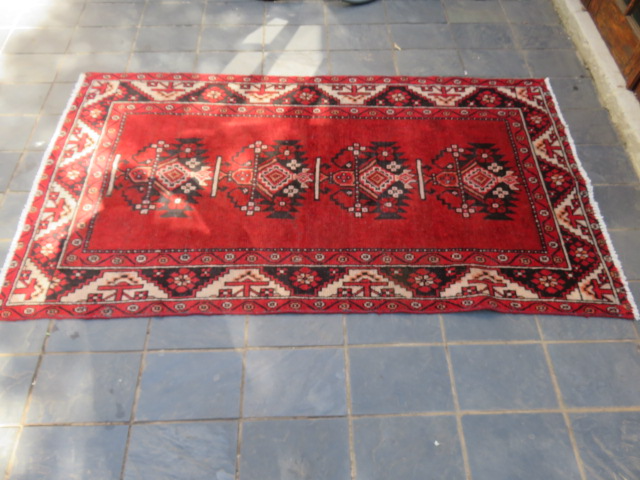 A Persian hand knotted Kordi rug.