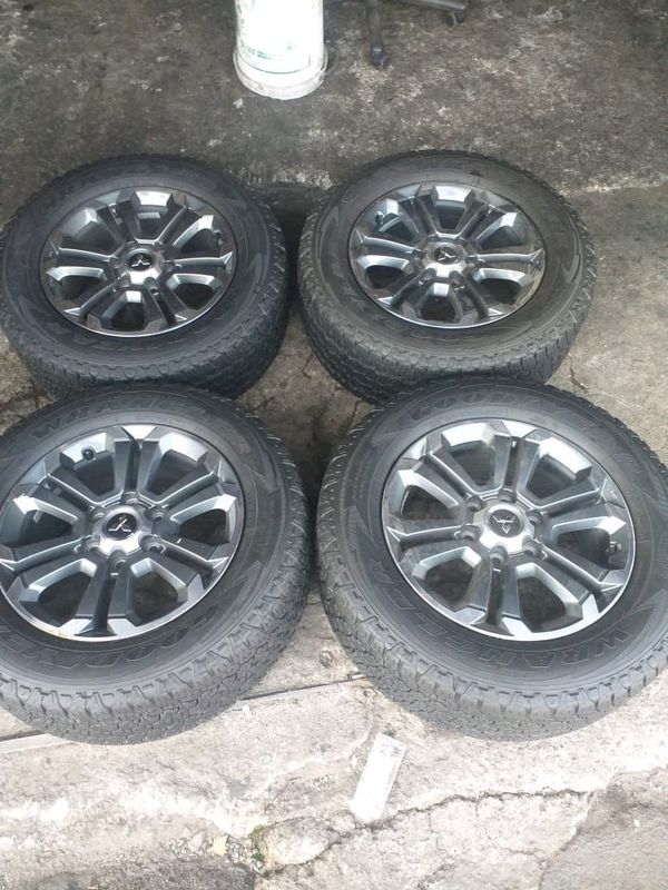 We are selling a set of clean 18 inch original Mitsubishi Triton mag rims with 90% Goodyear Wrangler