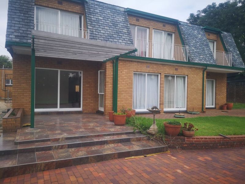 Welcome to a beautiful double story home in Klippoortjie  in a secured street with boom gate.