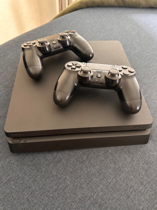 Playstation 4  1TB slim with extra console