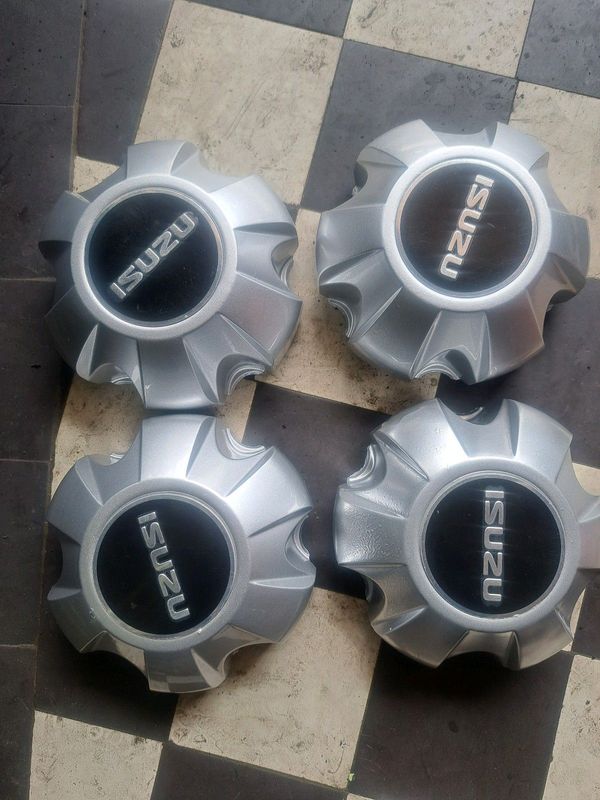 Isuzu wheels/center Caps Brand New.