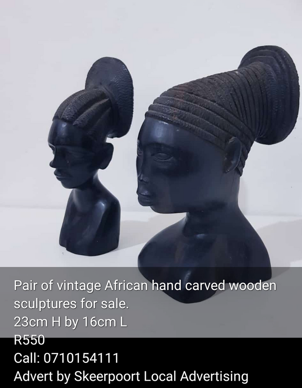 Pair of vintage hand carved African wooden sculptures for sale