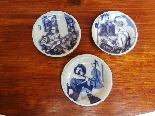 Collection of 3 small Delft wall plates.