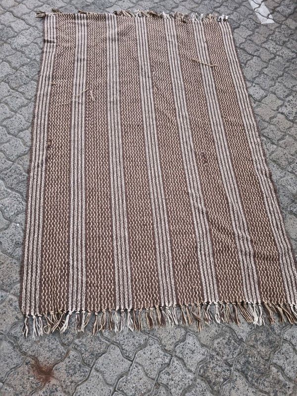 Brown thin rug size 180x114cm