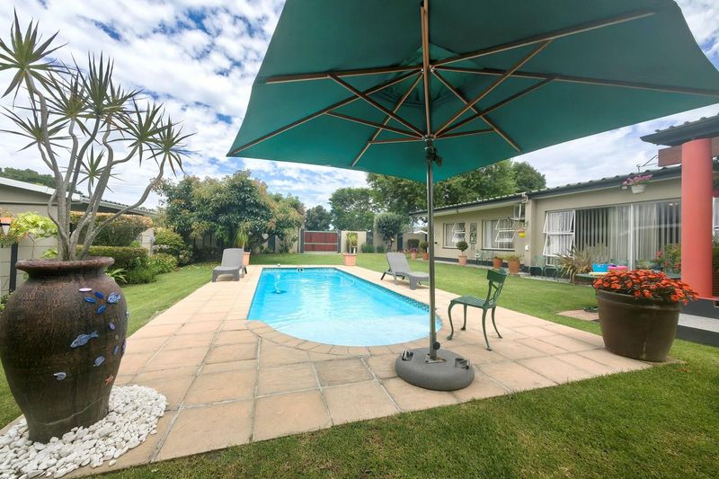 Exclusive Mandate Gem in Bergsig - Spacious 4-Bedroom Family Home with Pool and Avocado Trees!