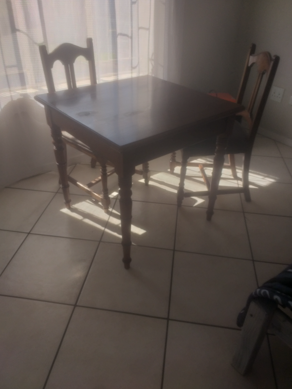 Wooden square table with 4 chairs.  Used itemsNeg R800.00