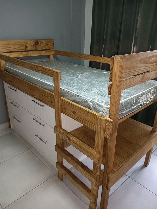 Wooden bed with drawers and shelf
