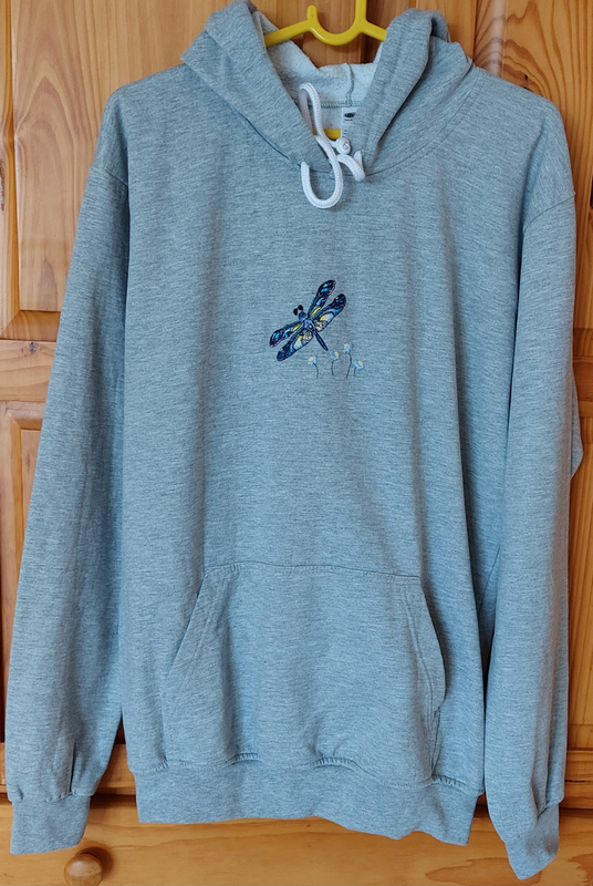 Hand embroidered dragonfly and flowers on a grey hoodie