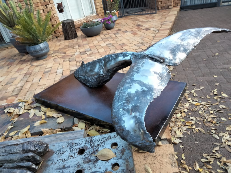 Stainless steel whale fluke sculpture