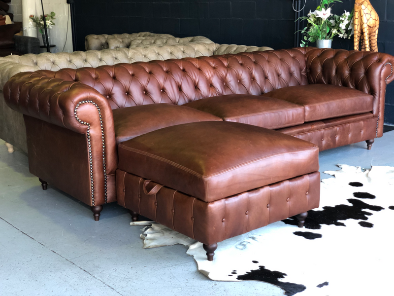 Extremely large 3m genuine leather CHESTERFIELD COUCH plus 1 x STORAGE DAYBED OTTOMAN, brand new.