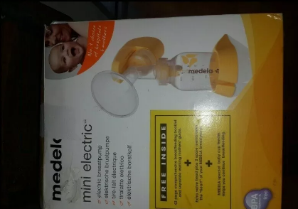 Medela Mini Electric breast feeding pump complete and still in box( but opened) unused present