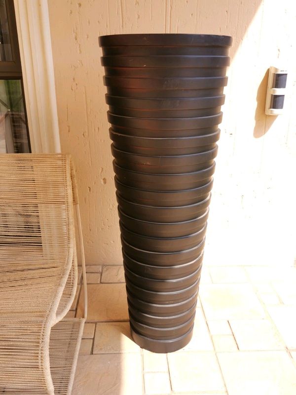 A beautiful full length designer vase, brand new slightly shop soiled. H135/W45