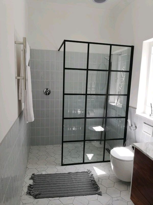 Frameless shower panels designed