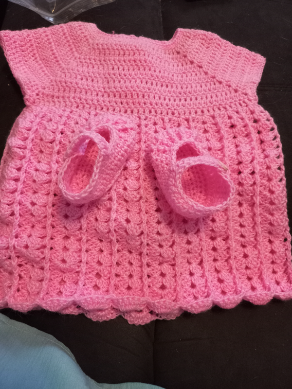 Hand knitted and crocheted baby clothes