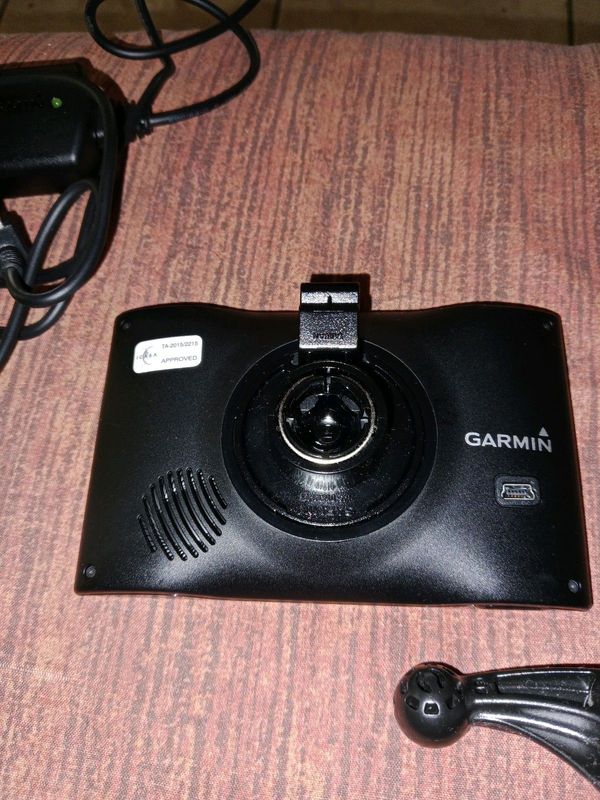 A Garmin with car charger. Black In colour.