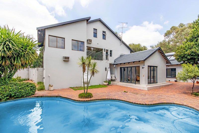Woodmead- Spacious modern furnished double storey, tucked away in a boomed enclosure!