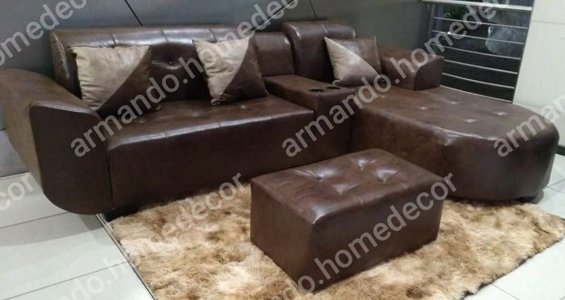 Brown corner couch with cushions