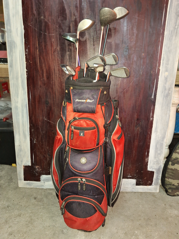 Golf bag with a few irons and clubs