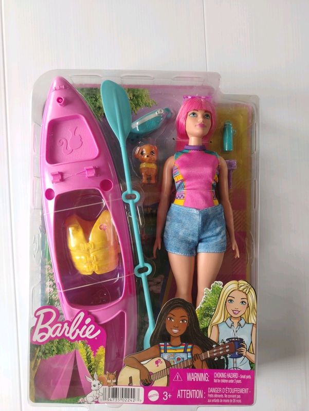 Barbie doll with camping accessories