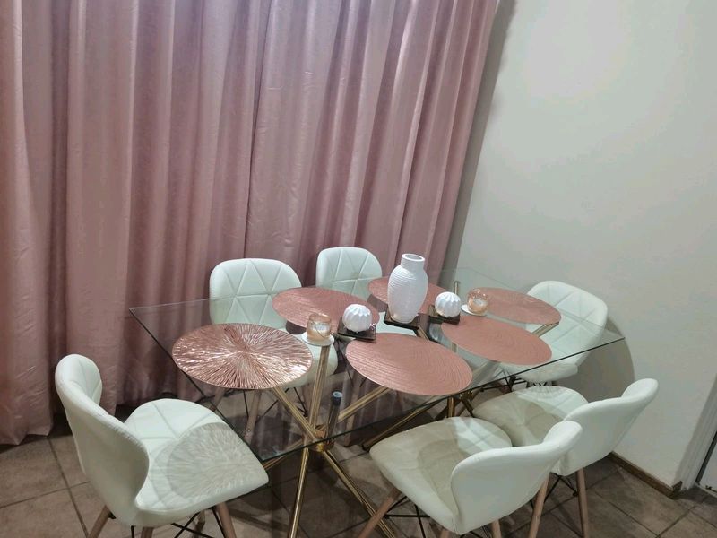 Glass table with 6 chairs