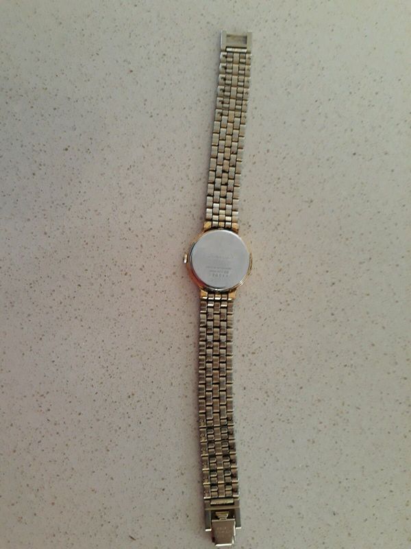 Seiko gold watch with white dial