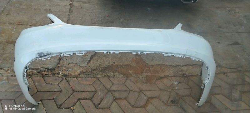 Mercedes Benz W205 rear bumper shell with silver chromes on the side and tow hook cover