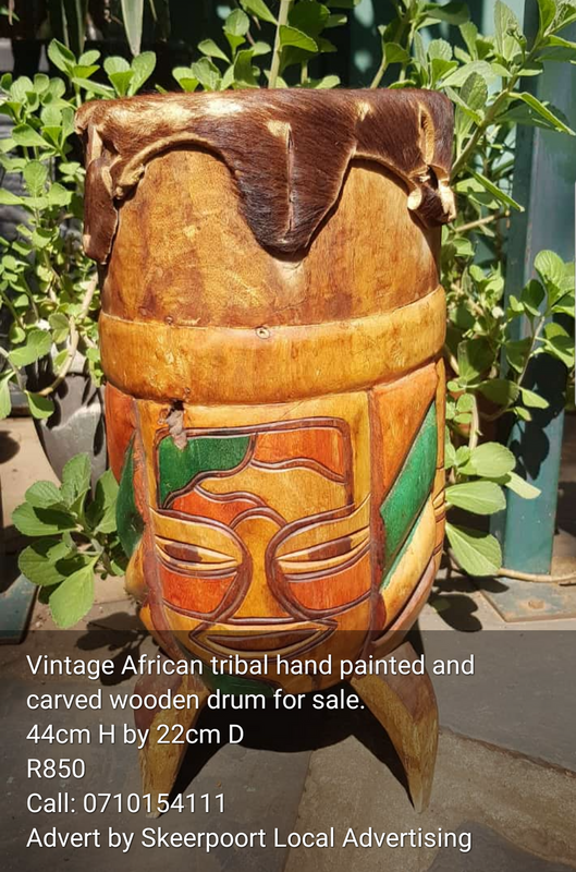 Vintage African tribal hand painted and carved wooden drum for sale.