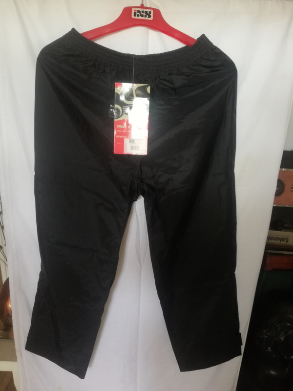 IMPORTED IXS WATERPROOF, NYLON, MOTORCYCLISTS RAIN PANTS.