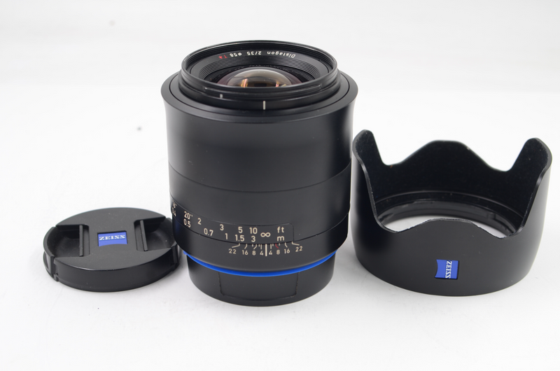 Zeiss Distagon 35mm F/2 MF lens in Canon  EF mount, caps and shade
