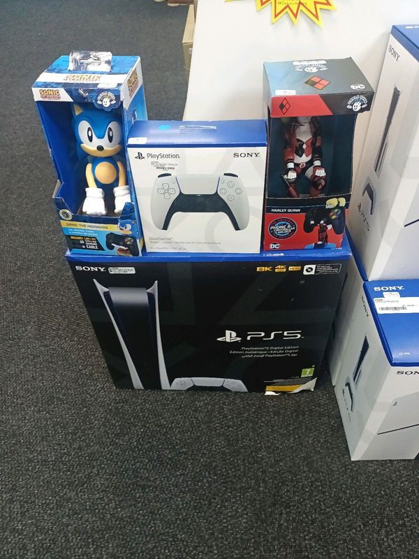 Ps5 Console with two controllers and two controllers holders