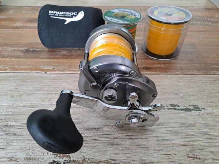 Shimano Torium 30 with neoprene reel cover, brand new braid and