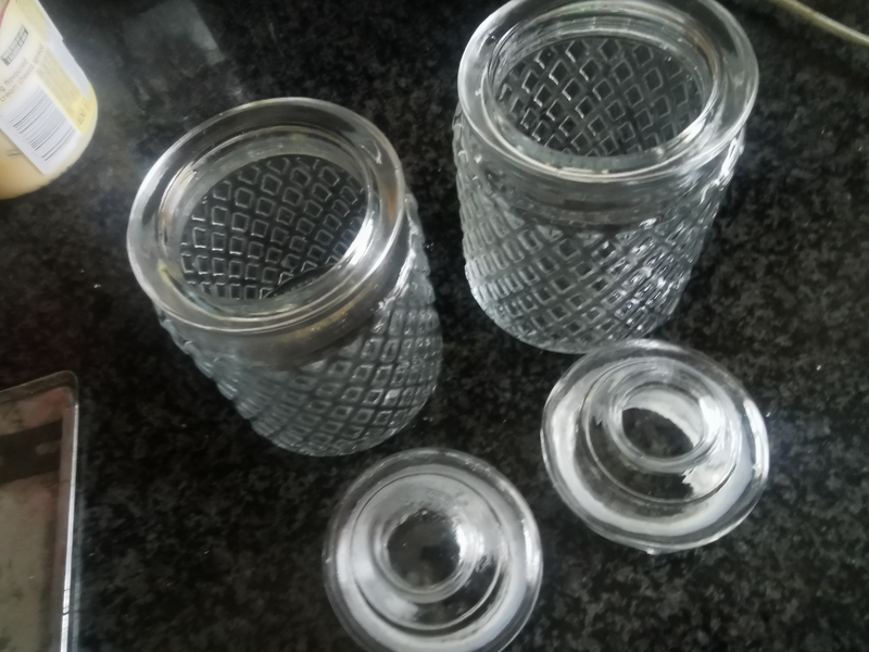 2 SMALL GLASS HOLDERS WITH LIDS