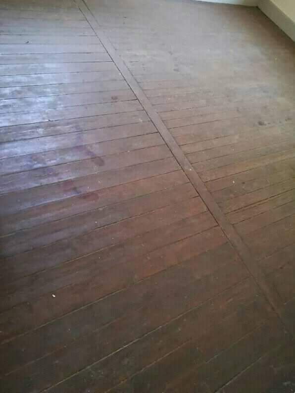 Stripping of old wooden floors and replacing with concrete floors