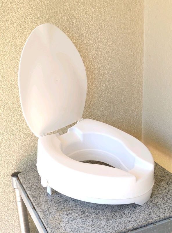 Raised toilet seat raiser with closing seat lid for sale