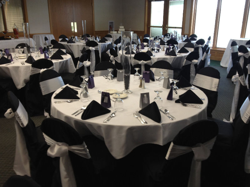 Black and white decor set up. 10 seater round tables and glass tables hire.