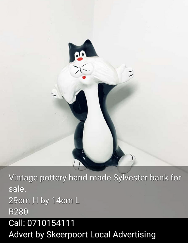 Vintage pottery hamd made Sylvester money bank for sale.