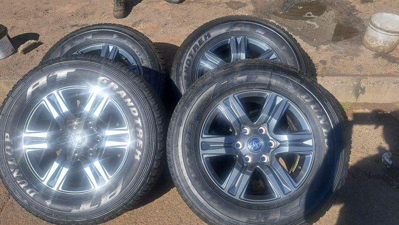17 inch toyota mags with 265 65 r17, 95% thread left, dunlop grandtrek.