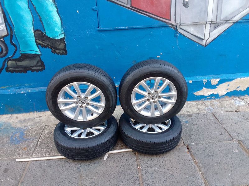 A set of 14inches original polo Vivo mags 5x100 PCD with 90% thread tyres Still in perfect condition
