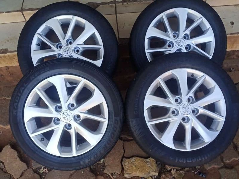16 inch toyota 5 holes mags and tires for sale.