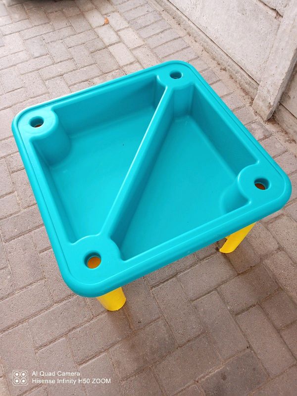 Sand and water table, wheel barrow and toys