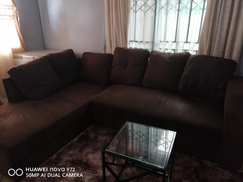 Brown L shaped couch