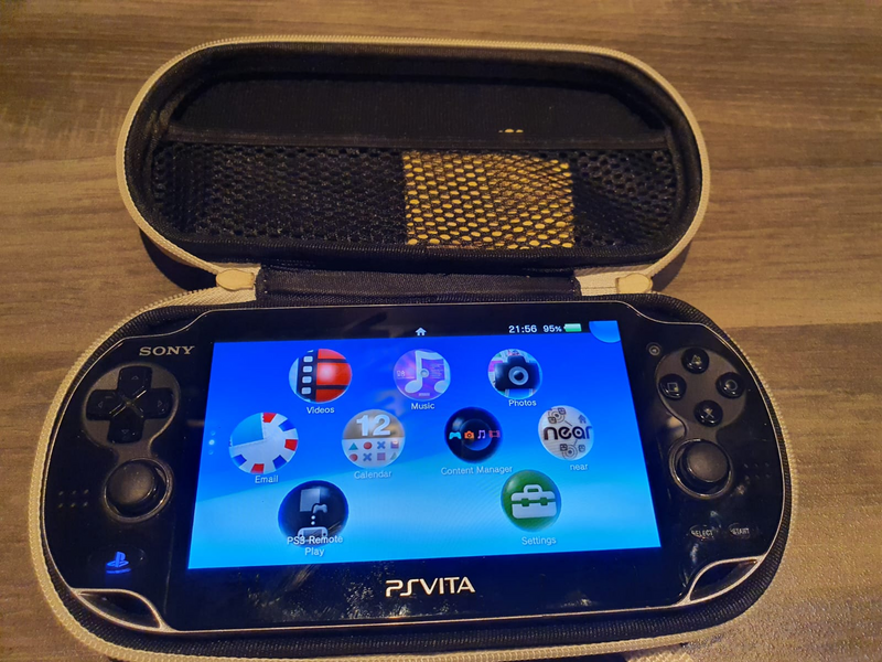 Sony PS Vita OLED model 1000 with original Charger,SD Card, Modded so can download any game
