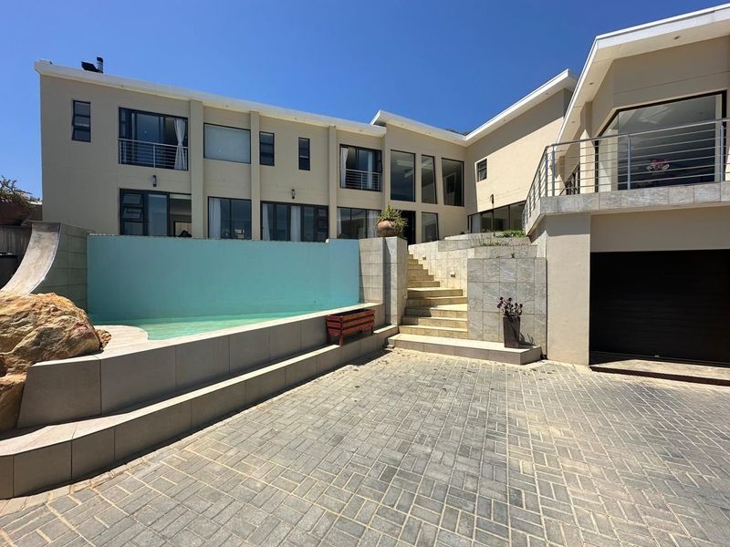 Luxury living awaits in this stunning coastal residence in Gordon&#39;s Bay!