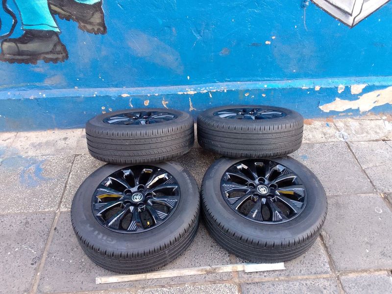 A set of 16inches original Toyota urban cruiser mags rim 5x114.3 PCD with 98% thread Tyres like new