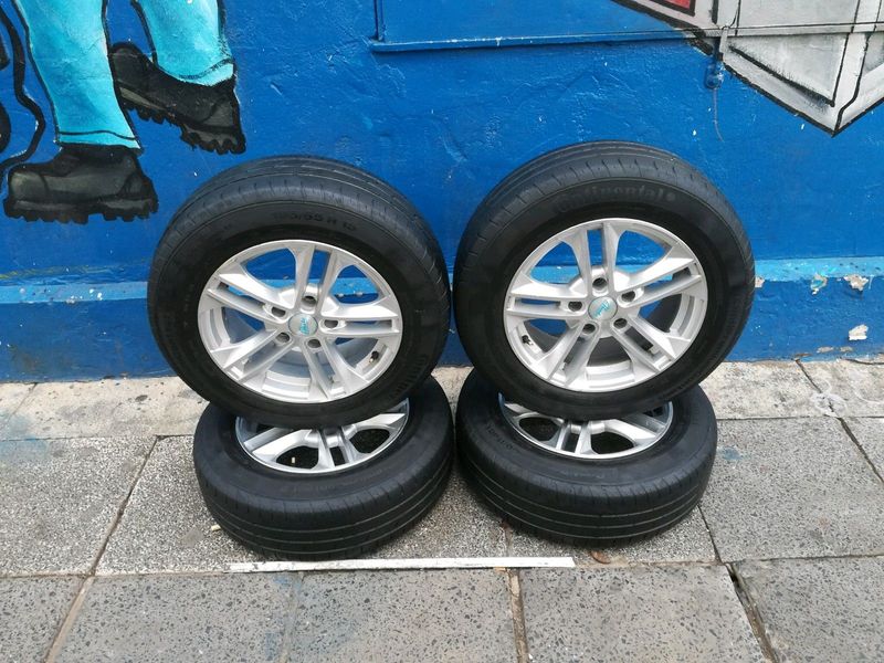 A set of 15inches 5x114 PCD mags with continental tyres for Toyota corolla quest/Toyota professional